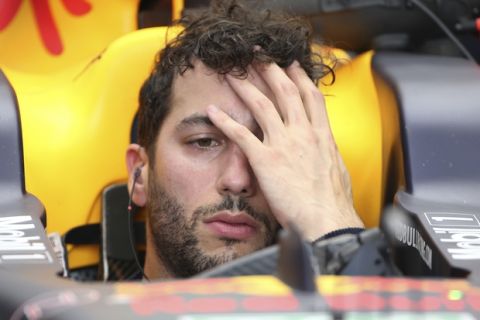Red Bull driver Daniel Ricciardo of Australia waits in his car during the second practice session for the Australian Grand Prix in Melbourne, Australia, Friday, March 24, 2017. (AP Photo/Rick Rycroft)