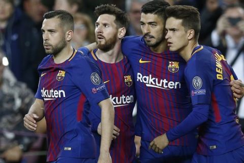 Barcelona's Luis Suarez, second right, celebrates his goal and the forth of his team with Lionel Messi, second left and other teammates during a Champions League quarter-final, first leg soccer match between FC Barcelona and Roma at the Camp Nou stadium in Barcelona, Spain, Wednesday, April 4, 2018.(AP Photo/ Manu Fernandez)