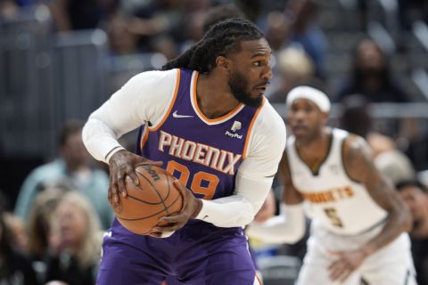 Phoenix Suns forward Jae Crowder (99) in the first half of an NBA basketball game Thursday, March 24, 2022, in Denver. (AP Photo/David Zalubowski)