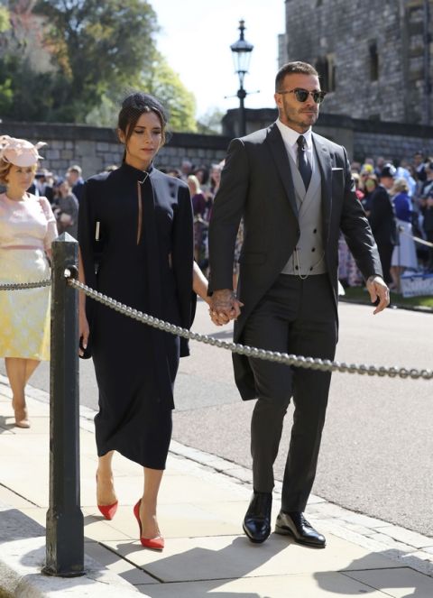 David Beckham and Victoria Beckham arrive for the wedding ceremony of Prince Harry and Meghan Markle at St. George's Chapel in Windsor Castle in Windsor, near London, England, Saturday, May 19, 2018. (Gareth Fuller/pool photo via AP)