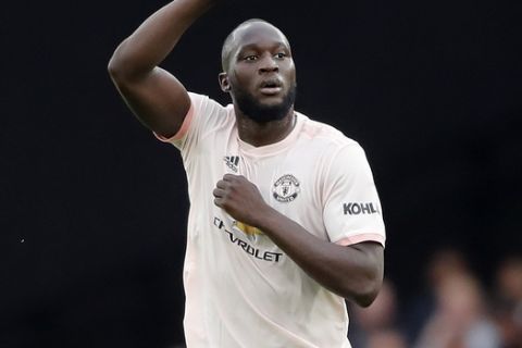 Manchester United's Romelu Lukaku celebrates after scoring his side's first goal during the English Premier League soccer match between Watford and Manchester United at Vicarage Road stadium in Watford, England, Saturday, Sept. 15, 2018.(AP Photo/Frank Augstein)