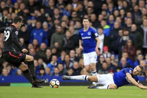 Arsenal's Granit Xhaka, left, and Everton's Nikola Vlasic battle for the ball during the English Premier League soccer match against Arsenal at the Goodison Park, Liverpool, England, Sunday Oct. 22, 2017. (Peter Byrne/PA via AP)