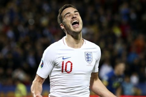 England's Harry Winks celebrates after scoring the opening goal of his team during the Euro 2020 group A qualifying soccer match between Kosovo and England at Fadil Vokrri stadium in Pristina, Kosovo, Sunday, Nov. 17, 2019. (AP Photo/Boris Grdanoski)