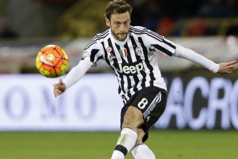 FILE - In this Friday, Feb. 19, 2016 filer, Juventus' Claudio Marchisio kicks the ball during the Serie A soccer match between Bologna and Juventus at the Dall' Ara stadium in Bologna, Italy. Defending champions Juventus will play AC Milan for the Italian Super Cup in Doha on Friday, Dec. 23, 2016. (AP Photo/Antonio Calanni, File)