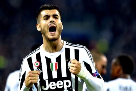 Juventus Alvaro Morata celebrates after he scored during the Champions League group D soccer match between Juventus and FC Sevilla, at the Juventus Stadium in Turin, Italy, Wednesday, Sept. 30, 2015. (AP Photo/Massimo Pinca)
