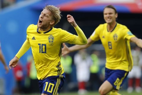 Sweden's Emil Forsberg celebrates the opening goal during the round of 16 match between Switzerland and Sweden at the 2018 soccer World Cup in the St. Petersburg Stadium, in St. Petersburg, Russia, Tuesday, July 3, 2018. (AP Photo/Efrem Lukatsky)