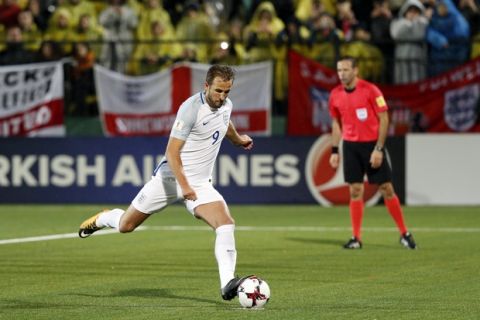 England's Harry Kane scoring his goal from penalty during their World Cup Group F qualifying soccer match between Lithuania and England at the LFF stadium in Vilnius, Lithuania, Sunday, Oct. 8, 2017. (AP Photo/Mindaugas Kulbis)
