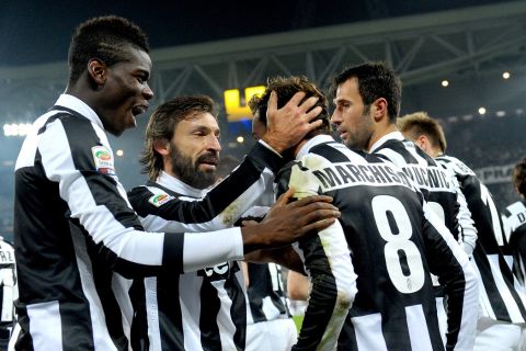 Juventus' Claudio Marchisio, center, celebrates with teammates Paul Pogba, left, Andrea Pirlo and Miko Vucinic after scoring, during a Serie A soccer match between Juventus and Torino at the Turin Juventus stadium, Italy, Saturday, Dec 1, 2012. (AP Photo/Massimo Pinca)
