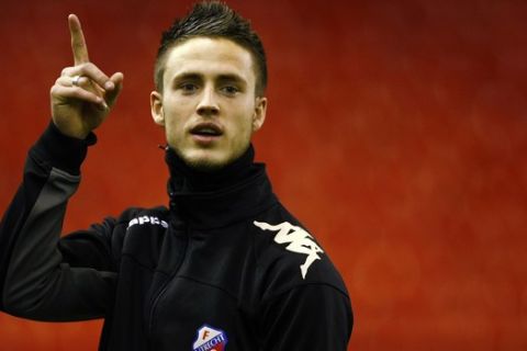 Utrecht's Ricky van Wolfswinkel during a training session held at Anfield, Liverpool, England, Tuesday Dec. 14, 2010. Utrecht play Liverpool in the first leg of their Europa League soccer match Wednesday. (AP Photo/Tim Hales)