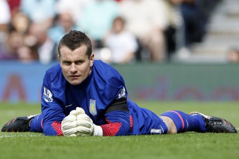 Aston Villa's goalkeeper Shay Given reacts after a Fulham player missed a chance to score during their English Premier League soccer match at Craven Cottage in London, Saturday, Aug. 13, 2011. (AP Photo/Akira Suemori)   