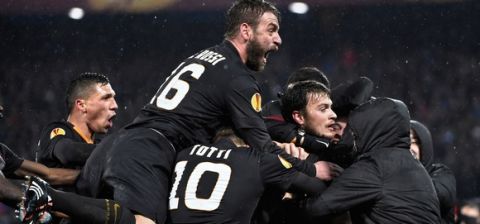Roma's Serbian forward Adem Ljajic (2nd R) celebrates with his teammates after scoring during the UEFA Europa League round of 32 match Feyenoord vs AS Roma in Rotterdam on February 26, 2015.AFP PHOTO / JOHN THYS        (Photo credit should read JOHN THYS/AFP/Getty Images)