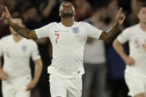England's Raheem Sterling celebrates scoring his side's first goal during the Euro 2020 group A qualifying soccer match between England and Kosovo at St Mary's Stadium in Southampton, England, Tuesday, Sept. 10, 2019 . (AP Photo/Matt Dunham)