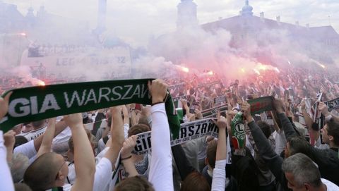 Fans of Warsaw's soccer team Legia Warszawa burn flares as they celebrate their club's victory of the Polish soccer championship in Warsaw, Poland, Monday, May 21, 2018.(AP Photo/Czarek Sokolowski)