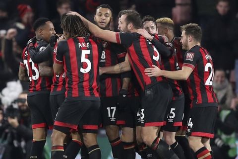 Bournemouth's Joshua King, cente, celebrates scoring his side's third goal of the game against Chelsea during their English Premier League soccer match at the Vitality Stadium in Bournemouth, Wednesday Jan. 30, 2019. (Andrew Matthews/PA via AP)