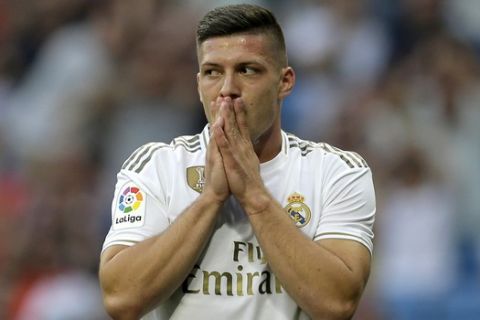Real Madrid's Luka Jovic gestures during the Spanish La Liga soccer match between Real Madrid and Valladolid at the Santiago Bernabeu stadium in Madrid, Spain, Saturday, Aug. 24, 2019. (AP Photo/Paul White)