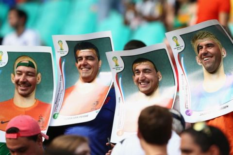 SALVADOR, BRAZIL - JUNE 13:  Fans wear cutout images of the Netherlands players before the 2014 FIFA World Cup Brazil Group B match between Spain and Netherlands at Arena Fonte Nova on June 13, 2014 in Salvador, Brazil.  (Photo by Quinn Rooney/Getty Images)