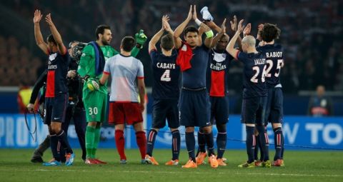 PARIS, FRANCE - MARCH 12:  PSG players celebrate victory after the UEFA Champions League Round of 16 second leg match between Paris Saint-Germain FC and Bayer Leverkusen at Parc des Princes on March 12, 2014 in Paris, France.  (Photo by Dean Mouhtaropoulos/Getty Images)