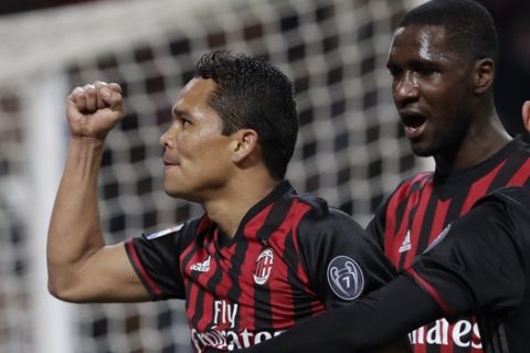AC Milan's Carlos Bacca celebrates after scoring his side's second goal during a Serie A soccer match between AC Milan and Chievo Verona, at the San Siro stadium in Milan, Italy, Saturday, March 4, 2017. (AP Photo/Luca Bruno)