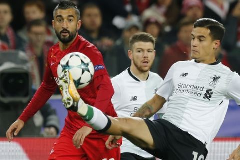 Spartak's Aleksandr Samedov, left, and Liverpool's Philippe Coutinho challenge for the ball during the Champions League soccer match between Spartak Moscow and Liverpool in Moscow, Russia, Tuesday, Sept. 26, 2017. (AP Photo/Alexander Zemlianichenko)