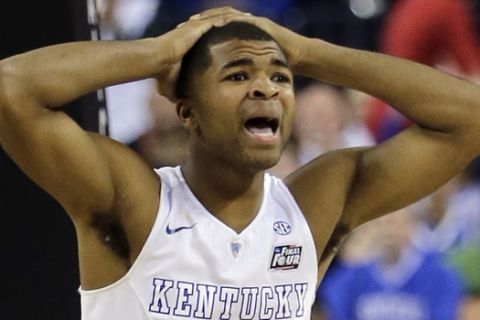 Kentucky's Aaron Harrison (2) reacts to a call during the second half of the NCAA Final Four tournament college basketball semifinal game Wisconsin Saturday, April 4, 2015, in Indianapolis. (AP Photo/David J. Phillip) 