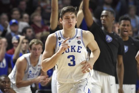 Duke's Grayson Allen (3) reacts after making a three-point basket against South Carolina during the second half in a second-round game of the NCAA men's college basketball tournament in Greenville, S.C., Sunday, March 19, 2017. (AP Photo/Rainier Ehrhardt)