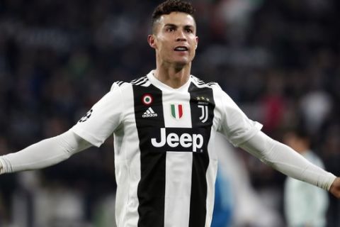 Juventus' Cristiano Ronaldo celebrates at the end of the Champions League round of 16, 2nd leg, soccer match between Juventus and Atletico Madrid at the Allianz stadium in Turin, Italy, Tuesday, March 12, 2019. Ronaldo scored the three goals in Juventus 3-0 win.(AP Photo/Antonio Calanni)