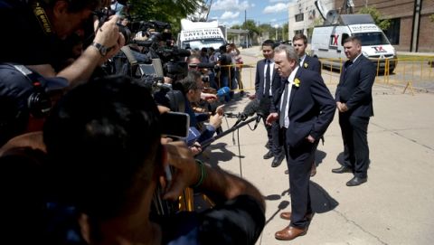 Cardiff City manager Neil Warnock talks to journalists outside the Club Atletico y Social San Martin where soccer player Emiliano Sala's wake is talking place in Progreso, Argentina, Saturday, Feb. 16, 2019. The Argentina-born forward died in an airplane crash in the English Channel last month when flying from Nantes in France to start his new career with English Premier League club Cardiff. (AP Photo/Natacha Pisarenko)