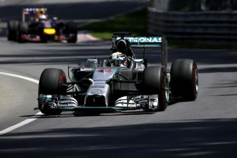 Mercedes driver Lewis Hamilton from Great Britain, drives through the course during the Canadian Grand Prix Sunday, June 8, 2014, in Montreal. Hamilton did not finish the race.(AP Photo/David J. Phillip)