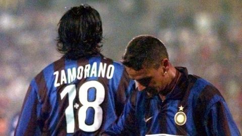 Chilean Ivan Zamorano of Inter of Milan and teammate Italian soccer ace Roberto Baggio catch their breath during the match against Skonto Riga from Latvia in the preliminary round  Champions League 1998-99, played in Pisa's Arena Garibaldi Stadium, Wednesday August 12, 1998.  Inter won 4-0. Zamorano is wearing a plus sign between his new no. 18 jersey because the no. 9 jersey he wore last year will be given to Brazilian ace Ronaldo for the 1998-99 season.   (AP Photo/Francesco Bellini)