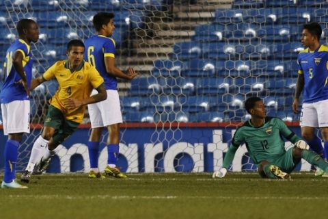 Australia's Tim Cahil, second left, runs to celebrate his goal against Ecuador during a friendly soccer match in London, Wednesday, March 5, 2014. Equador won the match 4-3. (AP Photo/Lefteris Pitarakis)