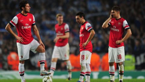 LONDON, ENGLAND - OCTOBER 24:  (L-R) Olivier Giroud, Santi Cazorla and Aaron Ramsey of Arsenal look dejected during the UEFA Champions League Group B match between Arsenal and FC Schalke at the Emirates Stadium on October 24, 2012 in London, England.  (Photo by Shaun Botterill/Getty Images)