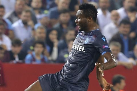 Trabzonspor's John Obi Mikel, right, fights for the ball with Basel's Valentin Stocker during a Europa League Group C soccer match between Trabzonspor and Basel in Trabzon, Turkey, Thursday, Oct. 3, 2019. (AP Photo)
