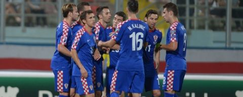 Croatia's Ivan Perisic celebrates with teammates after scoring during the Euro 2016 qualifying football match between Malta and Croatia on October 13, 2015 at the National Stadium in TaQali, Malta.  AFP PHOTO / MATTHEW MIRABELLI        (Photo credit should read Matthew Mirabelli/AFP/Getty Images)