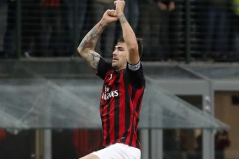 AC Milan's Alessio Romagnoli celebrates his side's 2-1 win at the end of the Serie A soccer match between AC Milan and Genoa at the San Siro Stadium in Milan, Italy, Wednesday, Oct. 31, 2018. (AP Photo/Antonio Calanni)