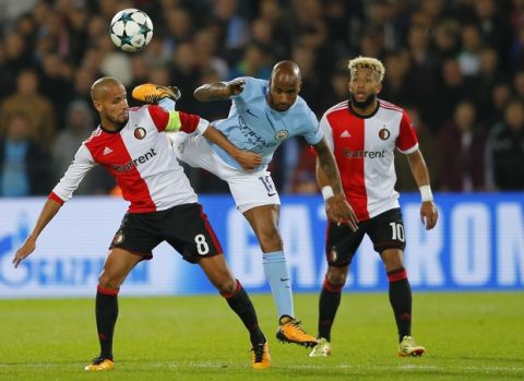 Manchester City's Fabian Delph, center, goes up against Feyenoord's Karim El Ahmadi, left, and Feyenoord's Tonny Vilhena during a Champions League Group F soccer match between Feyenoord and Manchester City at the Kuip stadium in Rotterdam, Netherlands, Wednesday, Sept. 13, 2017. (AP Photo/Peter Dejong)