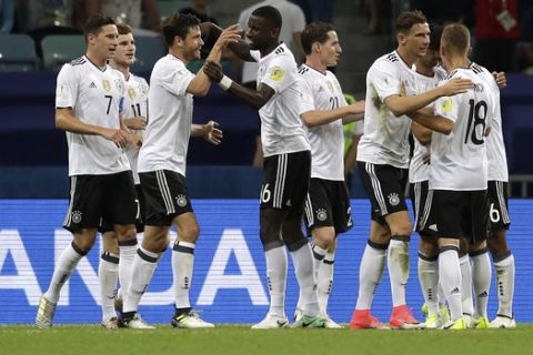 =Germany players celebrate after scoring their third goal during the Confederations Cup, semifinal soccer match between Germany and Mexico, at the Fisht Stadium in Sochi, Russia, Thursday, June 29, 2017. (AP Photo/Thanassis Stavrakis)