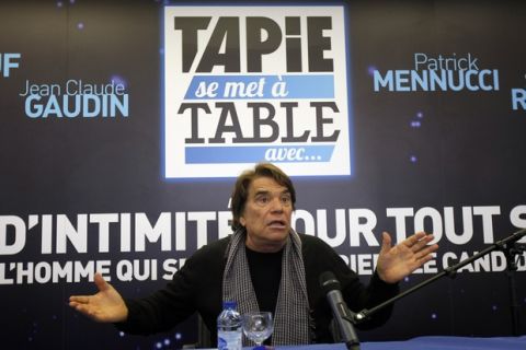 French businessman and majority shareholder of the "La Provence" group, Bernard Tapie, gestures as he speaks with the media during a press conference , at "La Provence newspaper, in Marseille, southern France, Wednesday, March 12, 2014. Tapie presented a new television program by Internet made by La Provence and broadcast this evening. AP Photo/Claude Paris)