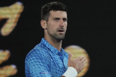 Novak Djokovic of Serbia reacts after defeating Enzo Couacaud of France in their second round match at the Australian Open tennis championship in Melbourne, Australia, Thursday, Jan. 19, 2023. (AP Photo/Aaron Favila)