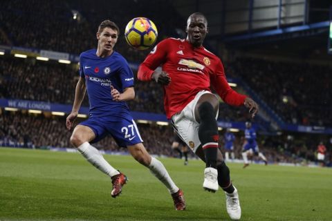 Chelsea's Andreas Christensen, left, vies for the ball with Manchester United's Romelu Lukaku during the English Premier League soccer match between Chelsea and Manchester United at Stamford Bridge stadium in London, Sunday, Nov. 5, 2017. (AP Photo/Kirsty Wigglesworth)