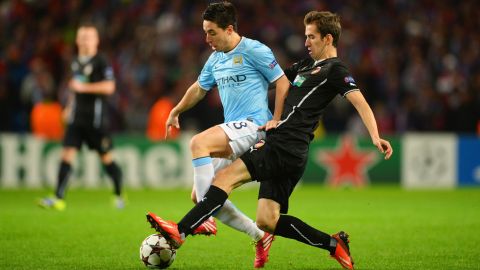 MANCHESTER, ENGLAND - NOVEMBER 27: Samir Nasri of Manchester City is tackled by Tomas Horava of Plzen during the UEFA Champions League Group D match between Manchester City and FC Viktoria Plzen at Etihad Stadium on November 27, 2013 in Manchester, England.  (Photo by Michael Regan/Getty Images)