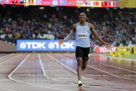 Botswana's Isaac Makwala celebrates after finishing a Men's 200m individual time trial during the World Athletics Championships in London Wednesday, Aug. 9, 2017. Makwala ran an individual time trial to qualify for the 200m semi-finals after he missed the 200m heats and the 400m final as he was barred from competing for 48 hours while organisers tried to halt a norovirus outbreak. (AP Photo/David J. Phillip)