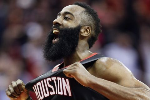 Houston Rockets guard James Harden reacts after making a three-point basket late in the second half of an NBA basketball game against the Utah Jazz, Monday, Dec. 17, 2018, in Houston. (AP Photo/Eric Christian Smith)