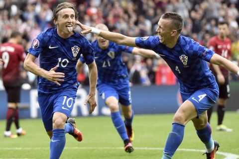 Croatia's Luka Modric celebrates after scoring the opening goal during the Euro 2016 Group D soccer match between Turkey and Croatia at the Parc des Princes stadium in Paris, France, Sunday, June 12, 2016. (AP Photo/Martin Meissner)