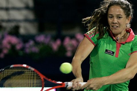 Patty Schnyder of Swiss returns the ball to Serbia's Ana Ivanovic during the second day of the Emirates Dubai WTA Tennis Championships in Dubai, United Arab Emirates Tuesday, Feb.15, 2011.(AP Photo/Nousha Salimi)