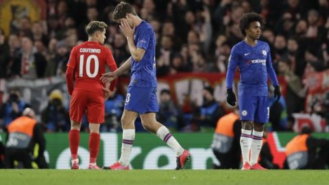 Chelsea's Marcos Alonso, center, leaves the field after being shown a red card during a first leg, round of 16, Champions League soccer match between Chelsea and Bayern Munich at Stamford Bridge stadium in London, England, Tuesday Feb. 25, 2020. (AP Photo/Kirsty Wigglesworth)