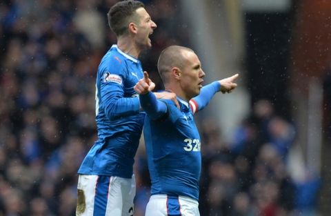 GLASGOW, SCOTLAND - DECEMBER 31:  Kenny Miller (R) of Rangers celebrates scoring the opening goal with his team mate Jason Holt (L) during the Ladbrokes Scottish Premiership match between Rangers and Celtic at Ibrox Stadium on December 31, 2016 in Glasgow, Scotland.  (Photo by Mark Runnacles/Getty Images)
