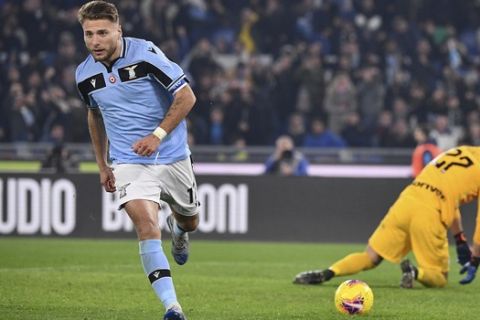 Lazio's Ciro Immobile, left, celebrates after he scored his side's first goal during the Serie A soccer match between Lazio and inter Milan, at Rome's Olympic stadium, Sunday, Feb. 16, 2020. (Alfredo Falcone/LaPresse via AP)