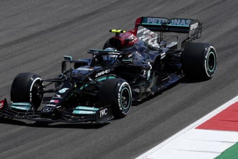 Mercedes driver Valtteri Bottas of Finland steers his car during the first free practice session ahead of the Portugal Formula One Grand Prix at the Algarve International Circuit near Portimao, Portugal, Friday, April 30, 2021. The Portugal Grand Prix will be held on Sunday. (AP Photo/Manu Fernandez)