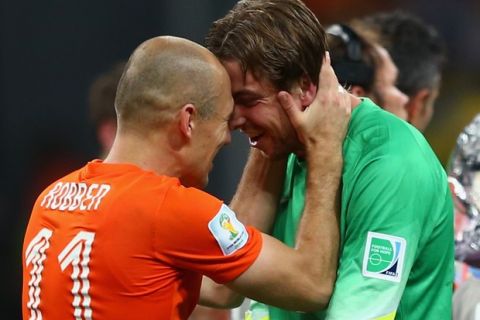 SALVADOR, BRAZIL - JULY 05:  Goalkeeper Tim Krul of the Netherlands celebrates with Arjen Robben after making a save in a penalty shootout to defeat Costa Rica during the 2014 FIFA World Cup Brazil Quarter Final match between the Netherlands and Costa Rica at Arena Fonte Nova on July 5, 2014 in Salvador, Brazil.  (Photo by Michael Steele/Getty Images)