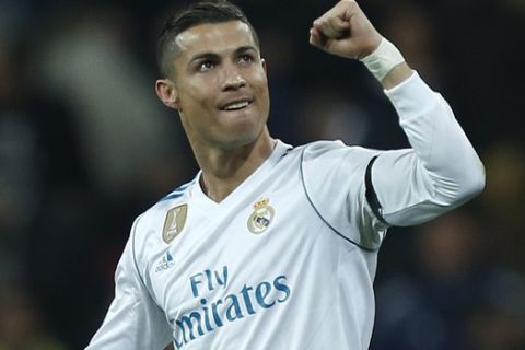 Real Madrid's Cristiano Ronaldo celebrates after scoring his side's second goal during the Champions League Group H soccer match between Real Madrid and Borussia Dortmund at the Santiago Bernabeu stadium in Madrid, Spain, Wednesday, Dec. 6, 2017. (AP Photo/Francisco Seco)